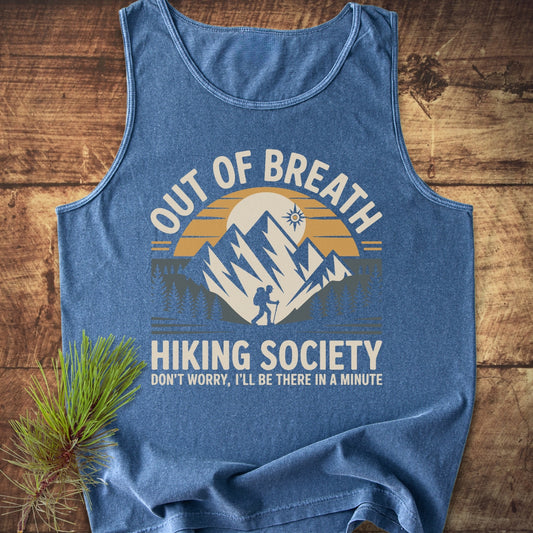 Out Of Breath Hiking Society Tank Top with a mountain graphic, sun, and hiker design. Blue heathered fabric, relaxed fit, made from sustainable US cotton with vibrant, eco-friendly dyes.