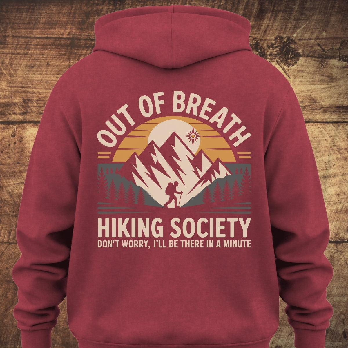 Out Of Breath Hiking Society BACKPRINT sweatshirt showcasing a hiker, mountains, and sunset design, with slogans. Features a cozy, garment-dyed, unisex fit, perfect for hiking or relaxing adventures.