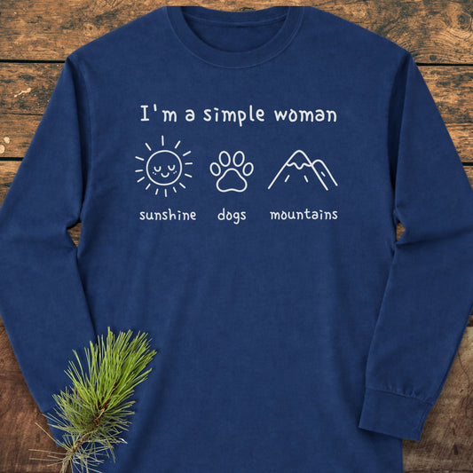 I'm A Simple Woman - Sunshine, Dogs, Mountains Long-Sleeve Tee features white text and icons of a sun, dog paw, and mountains on a navy-blue tee, emphasizing comfort and style with 100% ring-spun cotton.