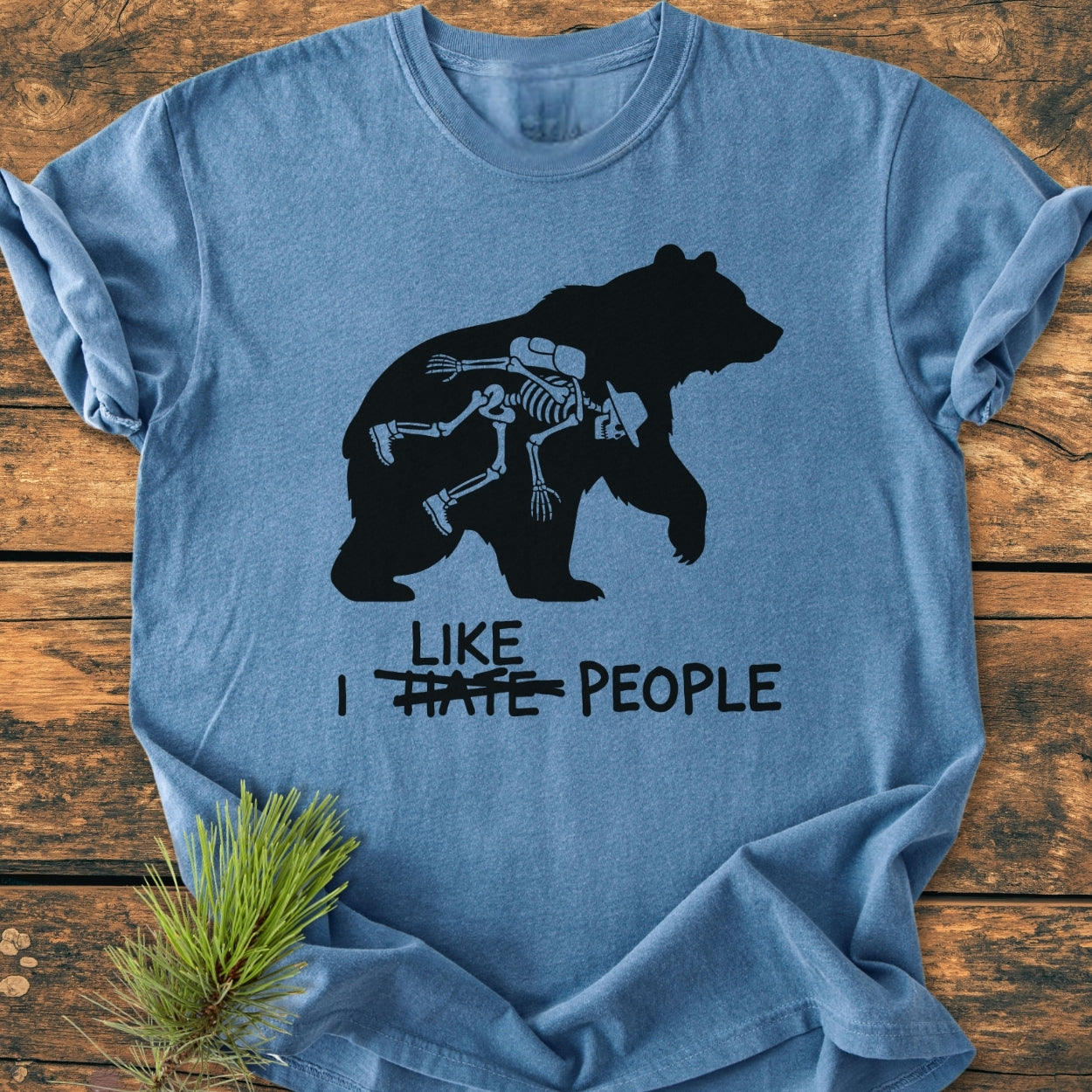I Hate People - Vintage Wash Tee featuring a bear silhouette with a human skeleton inside, humorously edited text, and laid flat, showcases the Comfort Colors' relaxed fit and durable stitching.