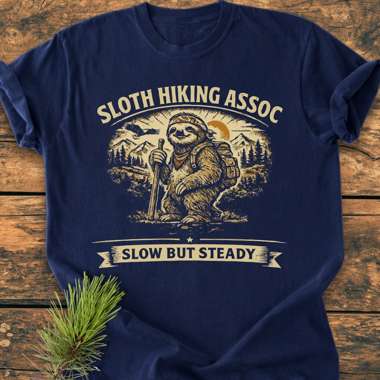 Sloth Hiking Assoc - Vintage Wash Tee featuring a sloth hiker design with mountains and sun, offering a relaxed fit in soft, durable, pre-shrunk 100% ring-spun cotton, perfect for daily wear.