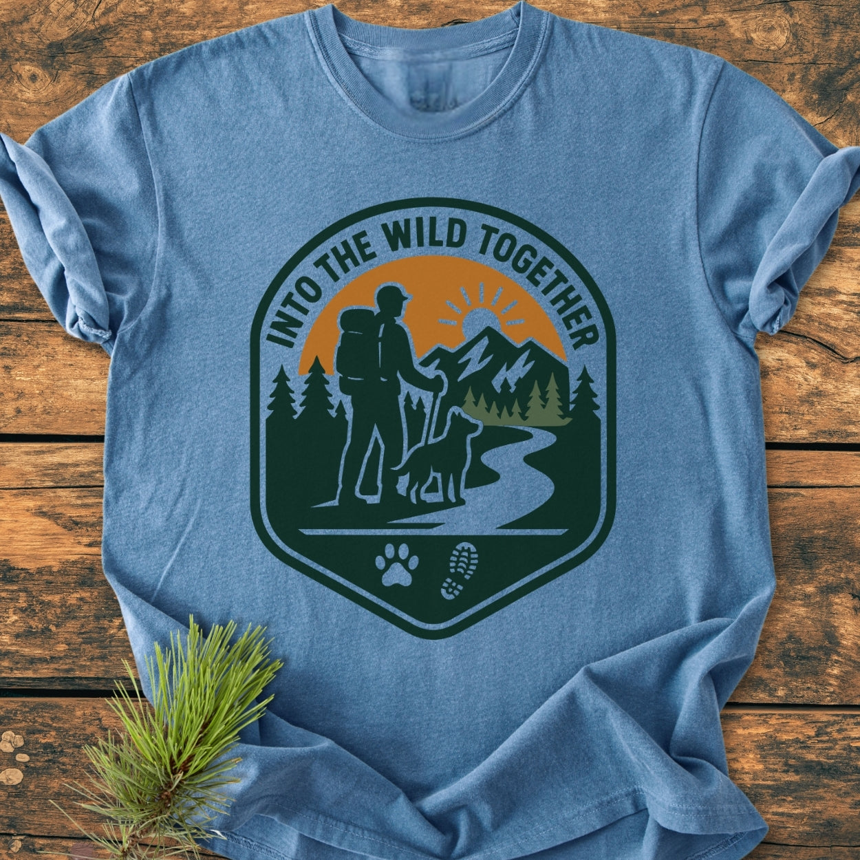 Into The Wild Together - Vintage Wash Tee featuring a hiker and dog graphic on a soft, durable garment-dyed fabric, highlighting a relaxed fit ideal for outdoor enthusiasts.
