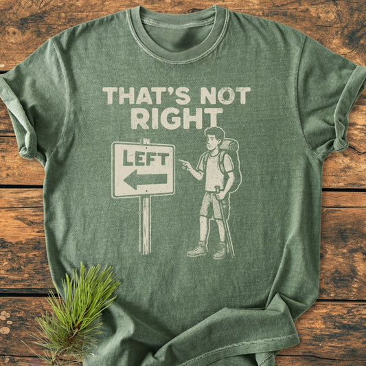 That's Not Right - Vintage Wash Tee: A washed-green T-shirt with a punny design featuring a bemused cartoon hiker beside a LEFT road sign. Made from soft, durable 100% ring-spun cotton.