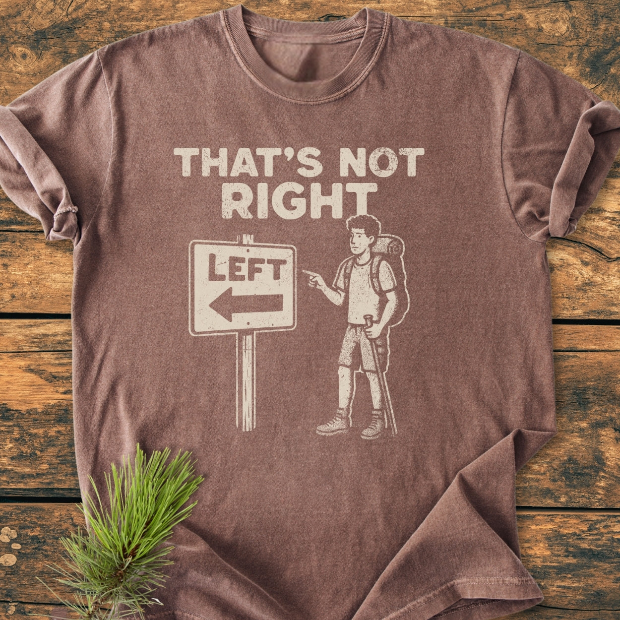 That's Not Right - Vintage Wash Tee featuring a hiker graphic with a road sign pun. Made from soft, garment-dyed 100% ring-spun cotton, this relaxed fit tee offers comfort and durability.