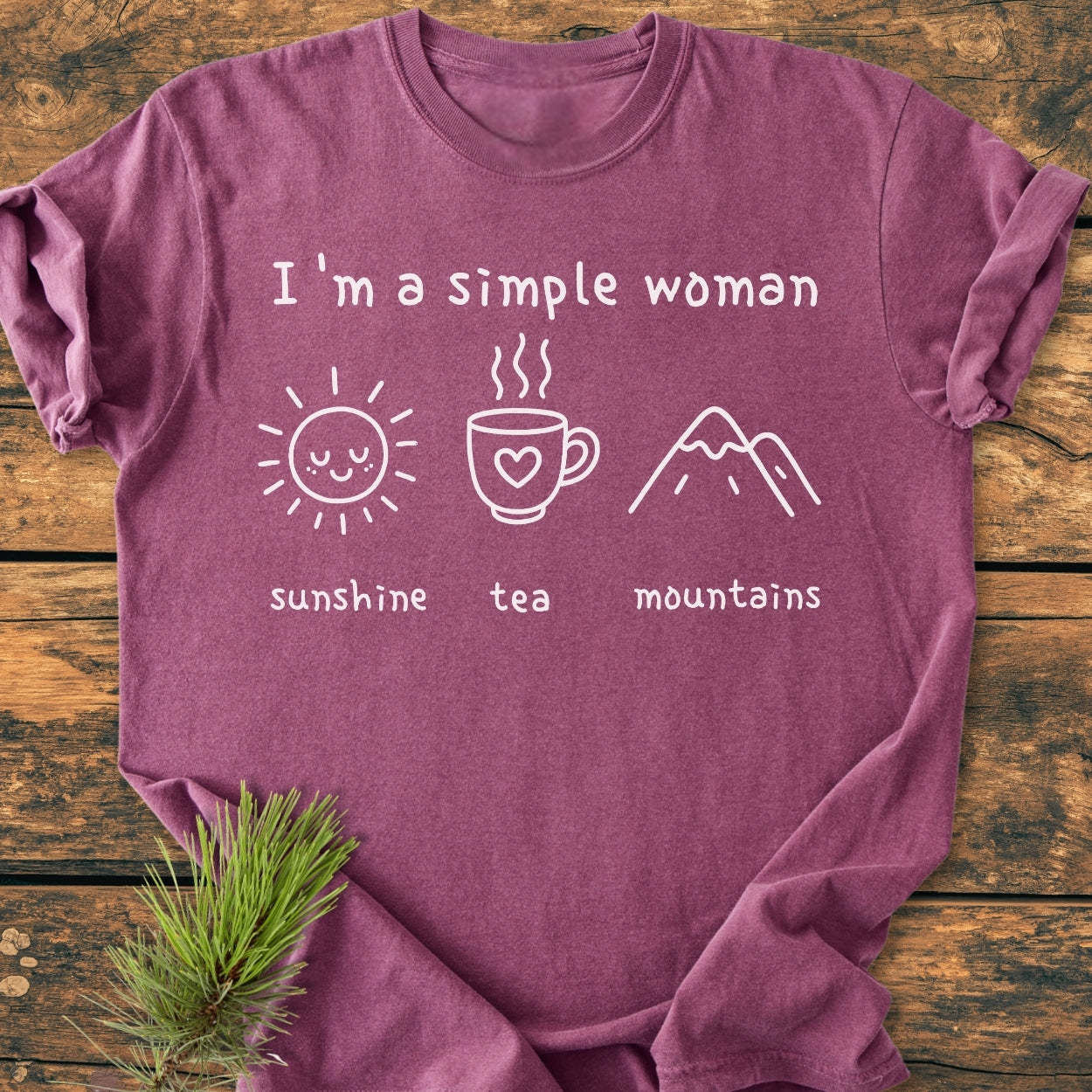 I'm A Simple Woman. Sunshine, Tea, Mountains - Vintage Wash Tee features white lettering and line-drawn icons of a sun, mug, and mountains on a soft, garment-dyed, relaxed fit T-shirt.