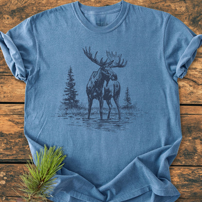 Moose - Vintage Wash Tee features a heather-blue, folded T-shirt with a bull moose illustration. Made from pre-shrunk, soft-washed, 100% ring-spun cotton for a relaxed, durable fit.
