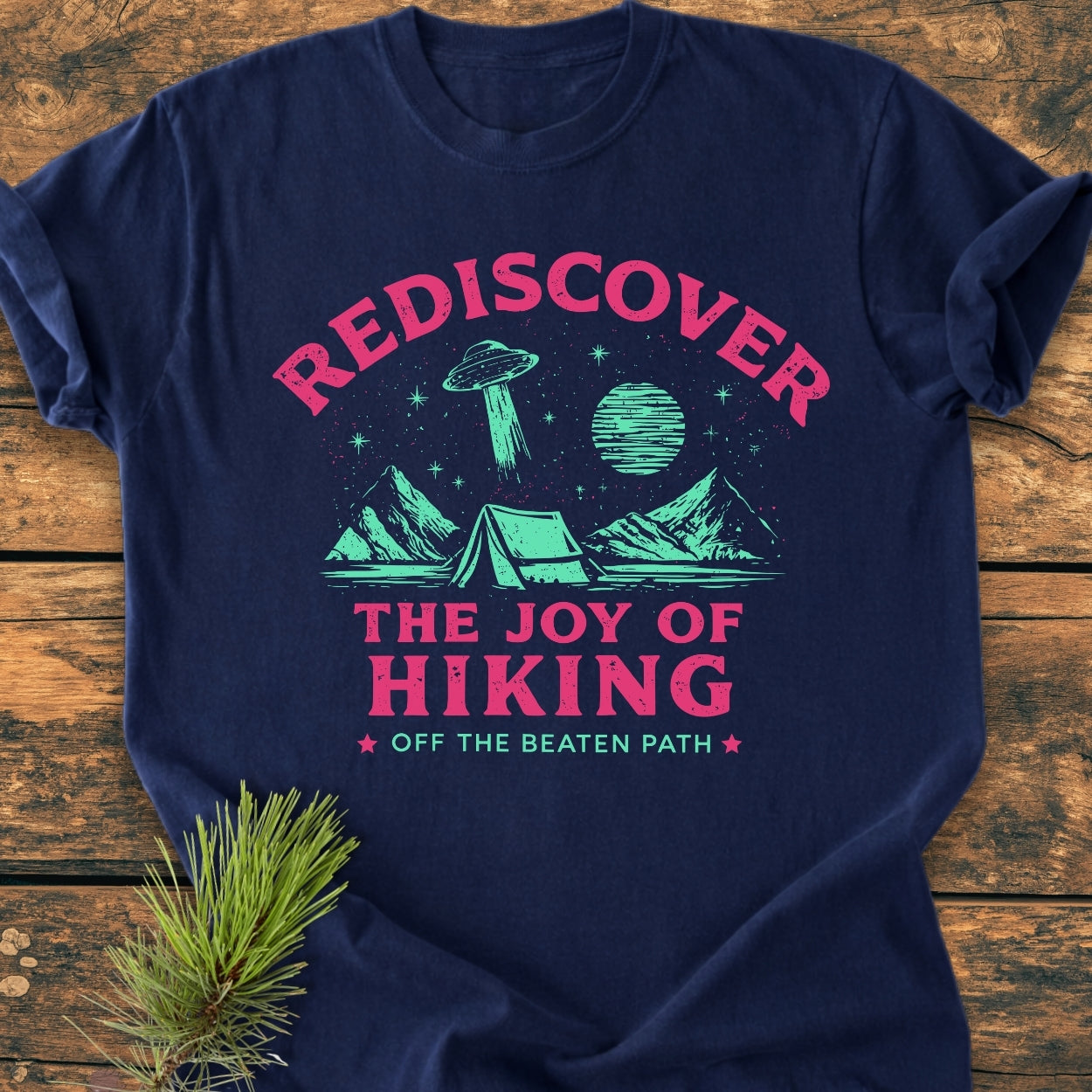 Rediscover The Joy Of Hiking - Vintage Wash Tee features a tent under a starry sky with a flying saucer, printed in vibrant ink on a navy-blue Comfort Colors garment-dyed cotton T-shirt.