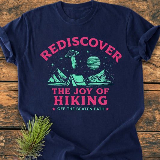 Rediscover The Joy Of Hiking - Vintage Wash Tee features a tent under a starry sky with a flying saucer, printed in vibrant ink on a navy-blue Comfort Colors garment-dyed cotton T-shirt.