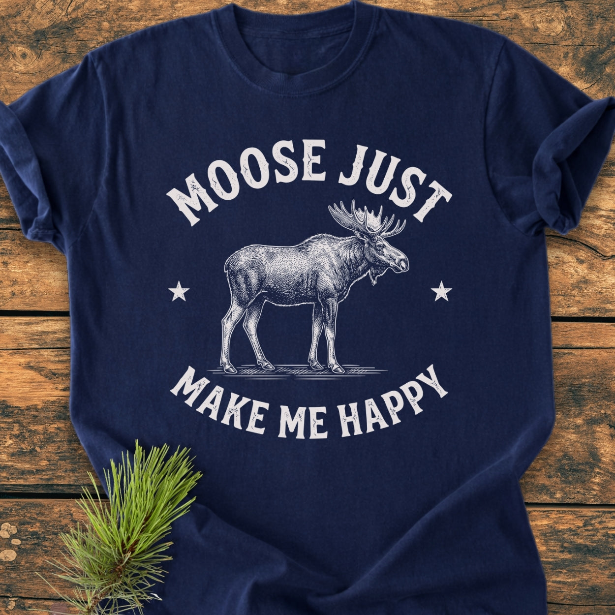 Moose Make Me Happy - Vintage Wash Tee features a vintage moose design with stars on a navy-blue shirt, offering a relaxed fit and soft texture perfect for everyday wear.