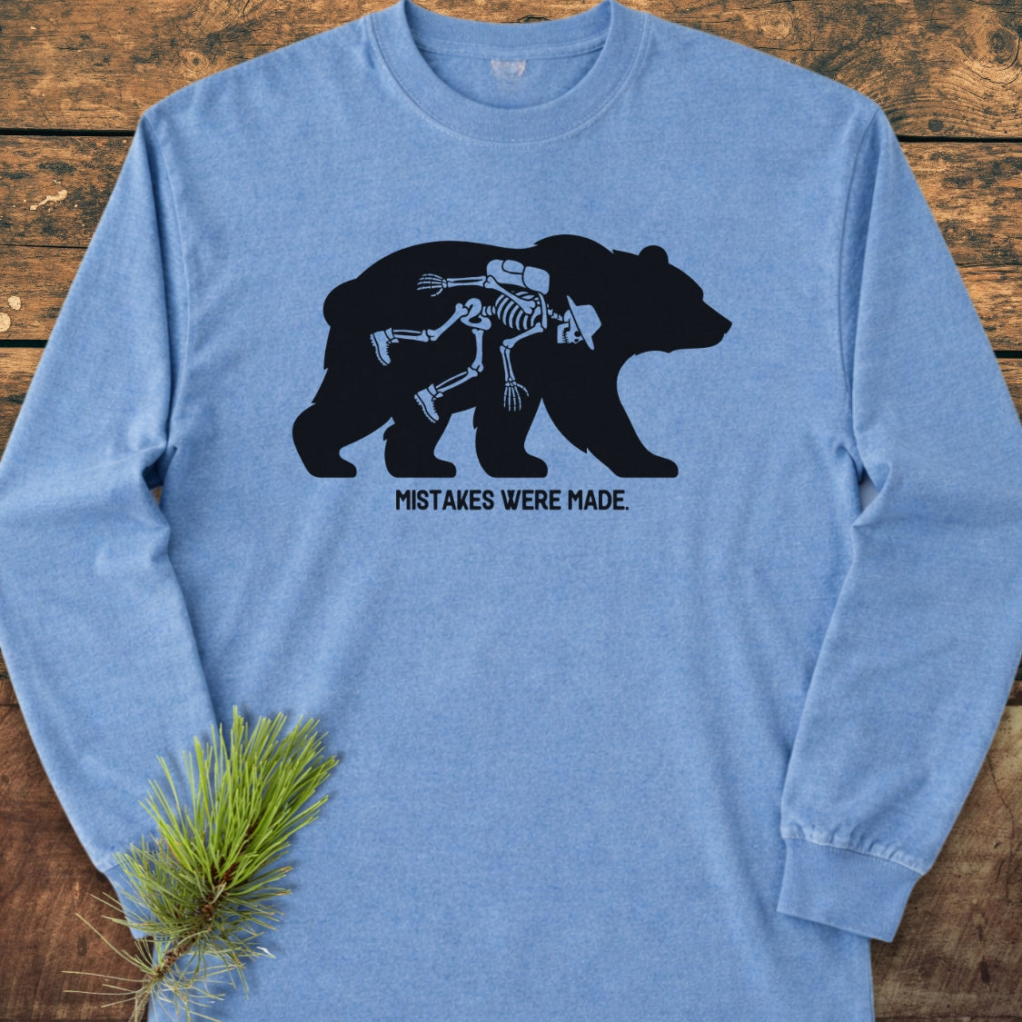 Mistakes Were Made Long-Sleeve Tee featuring a bear silhouette with a human skeleton outline. Crafted from 100% ring-spun cotton for a soft, relaxed fit, perfect for casual wear.