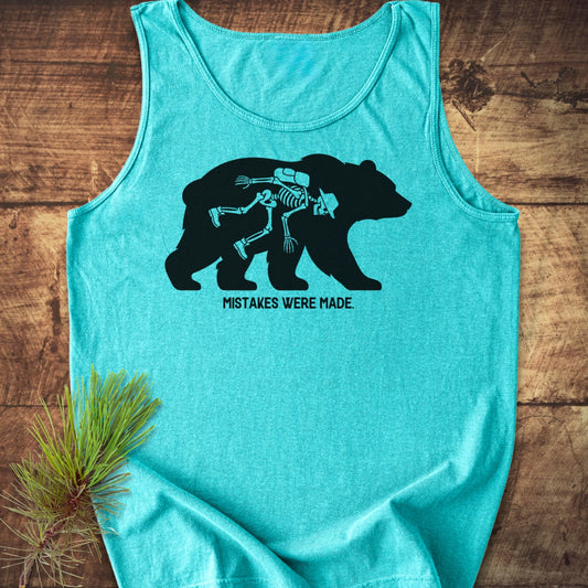 Mistakes Were Made Tank Top features a black bear silhouette with a hiker's skeleton on a turquoise-blue background, laid flat with a pine sprig, emphasizing style and sustainability.
