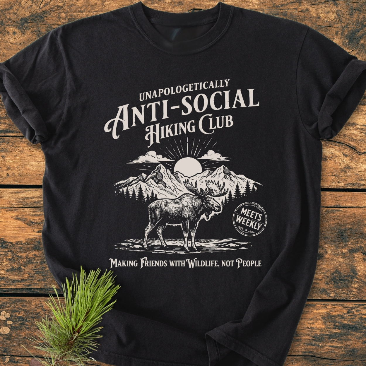 Anti-Social Hiking Club - Vintage Wash Tee featuring a moose, pine trees, mountains, and sunrise, with slogans. Made of soft, durable 100% ring-spun cotton, offering a relaxed fit.
