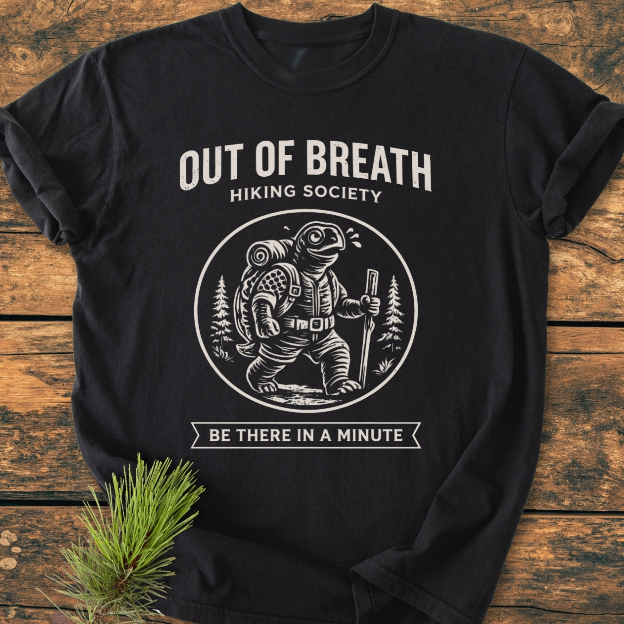 Out Of Breath Turtle - Vintage Wash Tee featuring a cartoon turtle with a backpack, hiking stick, and sweat drops. HIKING SOCIETY and BE THERE IN A MINUTE text complete the playful design.