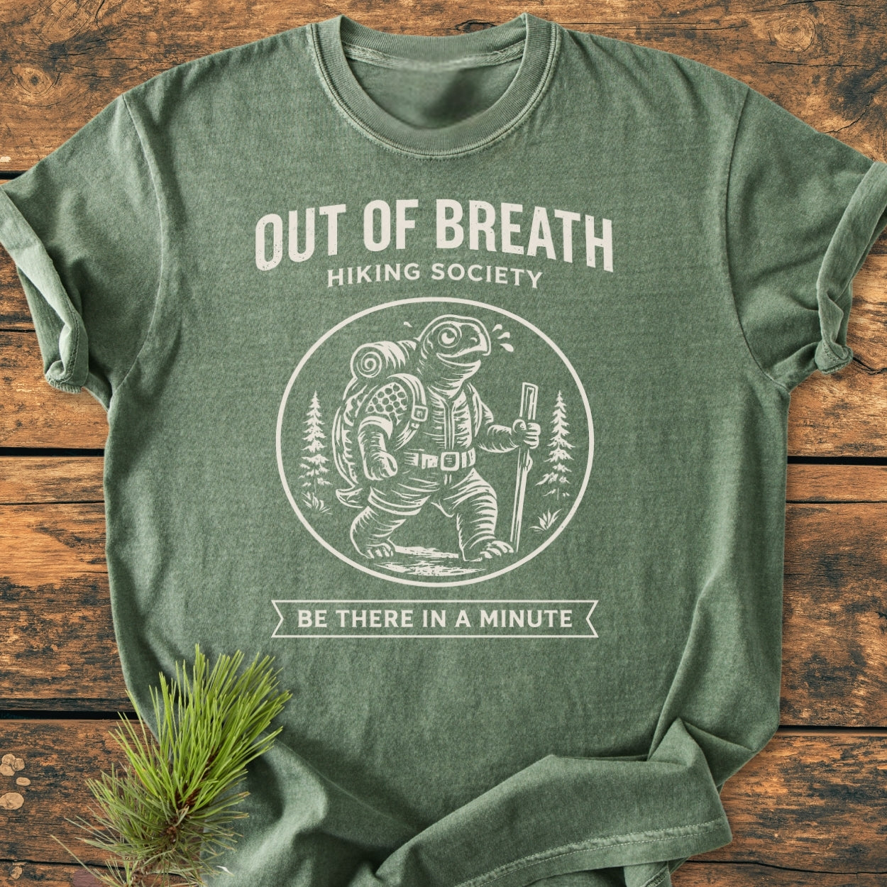 Out Of Breath Turtle - Vintage Wash Tee featuring a hiking turtle graphic with sweat drop, surrounded by OUT OF BREATH HIKING SOCIETY and BE THERE IN A MINUTE text on a crew-neck T-shirt.