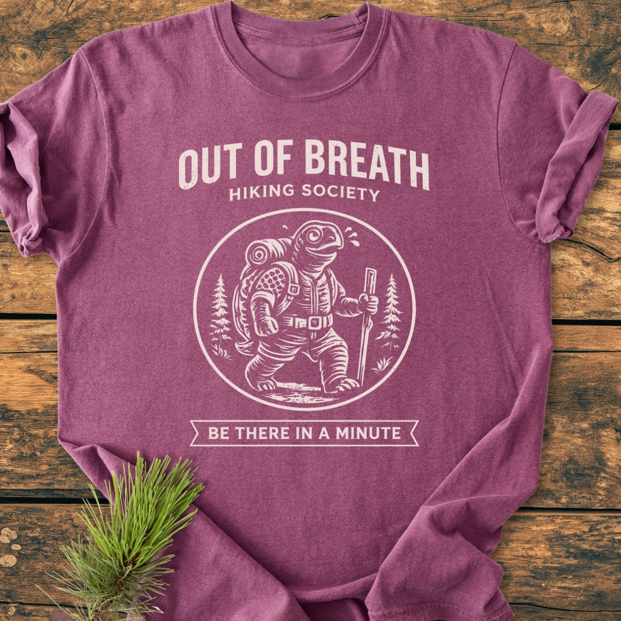 Out Of Breath Turtle - Vintage Wash Tee features a turtle with camping gear, strolling under pines on a heathered-purple T-shirt, laid flat, emphasizing cozy, durable Comfort Colors garment-dyed fabric.