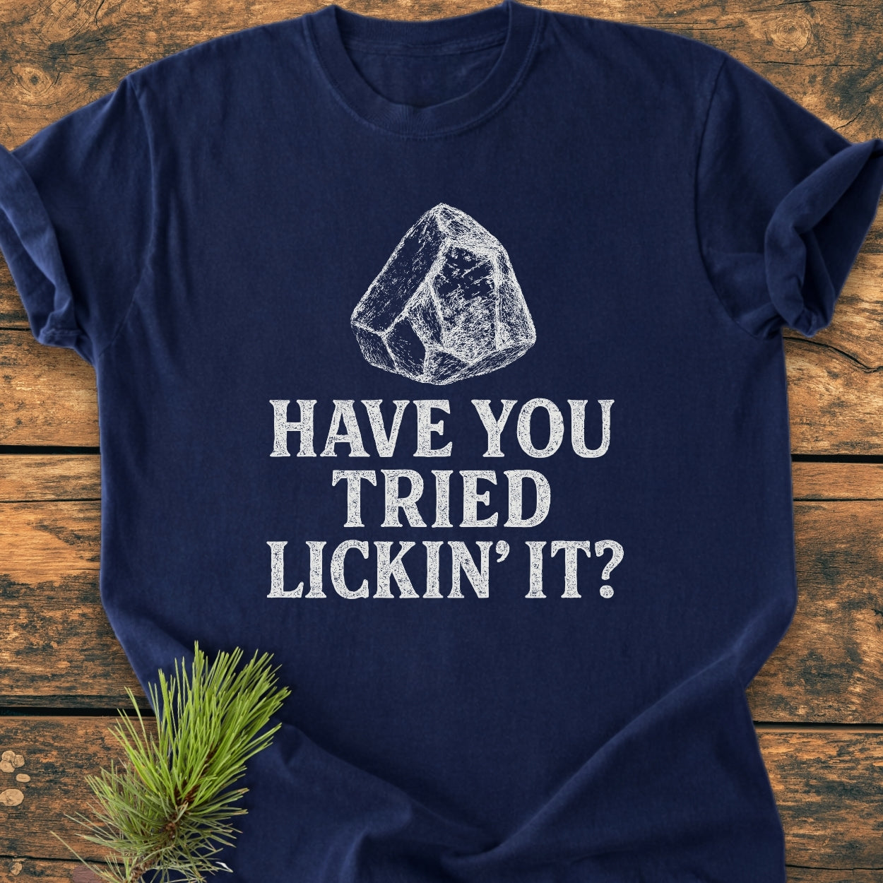 Have You Tried ... Rockhound - Vintage Wash Tee laid flat, showcasing a playful salt lick graphic and chalk-style text, highlighting its relaxed fit and garment-dyed softness on a wooden surface.