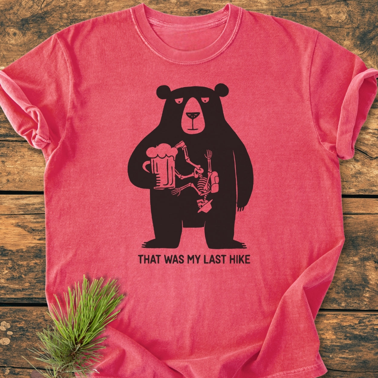 That Was My Last Hike - Vintage Wash Tee: Relaxed-fit tee with a cartoon bear holding a beer and a hiker’s skeleton. Made from soft-washed, pre-shrunk ring-spun cotton for comfort and durability.