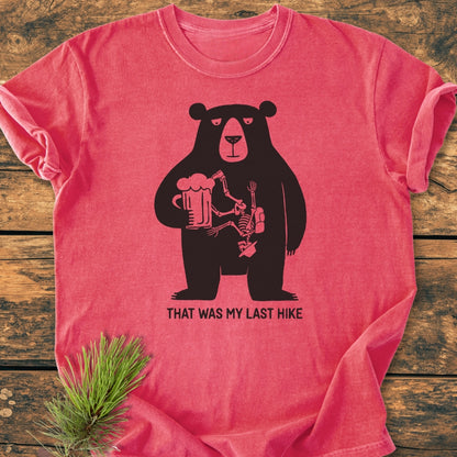 That Was My Last Hike - Vintage Wash Tee: Relaxed-fit tee with a cartoon bear holding a beer and a hiker’s skeleton. Made from soft-washed, pre-shrunk ring-spun cotton for comfort and durability.