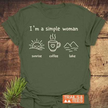 I'm A Simple Woman - Sunrise Coffee Lake T-Shirt on rustic wood, featuring sunrise, coffee, and lake icons. Trails & Tees logo in corner. Soft cotton, pre-shrunk, durable prints, outdoor-themed design.