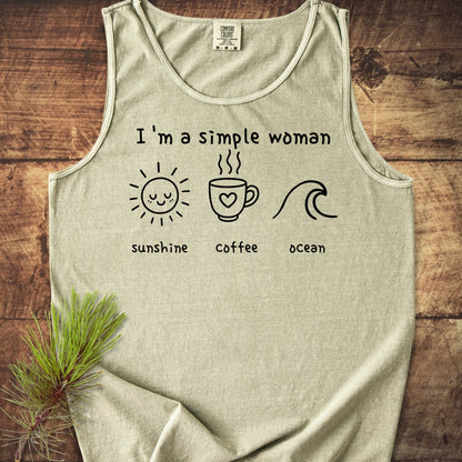 I'm A Simple Woman - Sunshine Coffee Ocean Tank Top: Light-grey tank top featuring black line-drawings of a sun, coffee mug, and wave, each with captions, laid on a wooden surface.