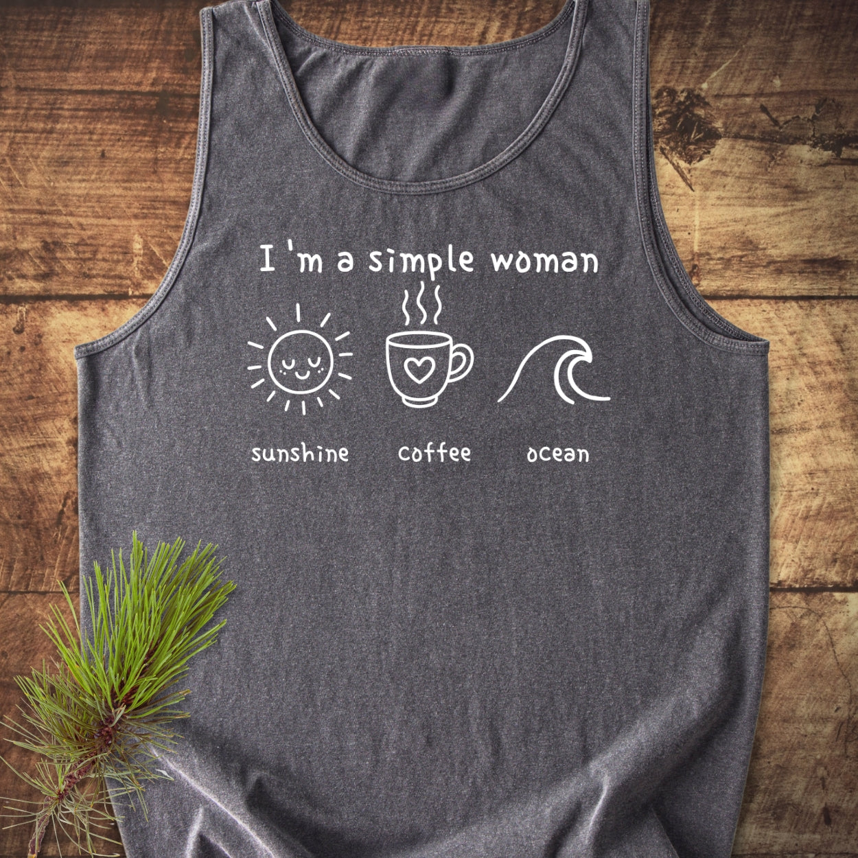 Heather-gray I'm A Simple Woman - Sunshine Coffee Ocean Tank Top on wooden surface, featuring white screen-print with sun, coffee mug, and ocean icons. Relaxed fit, 100% ring-spun US cotton.