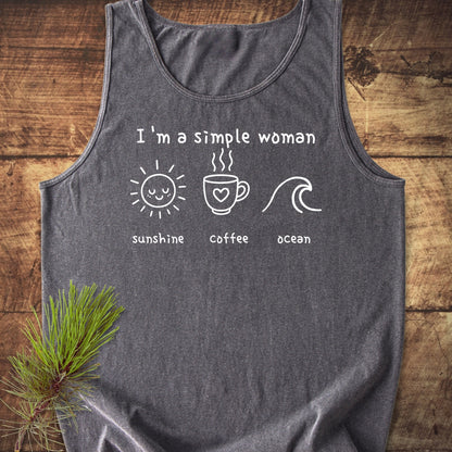 Heather-gray I'm A Simple Woman - Sunshine Coffee Ocean Tank Top on wooden surface, featuring white screen-print with sun, coffee mug, and ocean icons. Relaxed fit, 100% ring-spun US cotton.