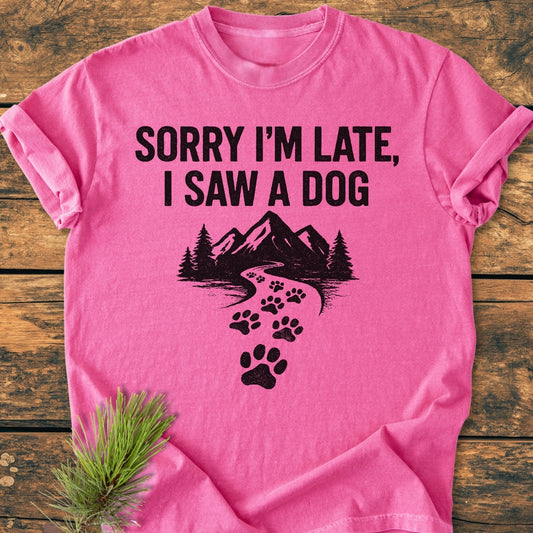 Sorry I'm Late - Vintage Wash Tee featuring bold text and a mountain scene with dog paw prints; a soft, relaxed fit made of durable ring-spun cotton, perfect for everyday wear.