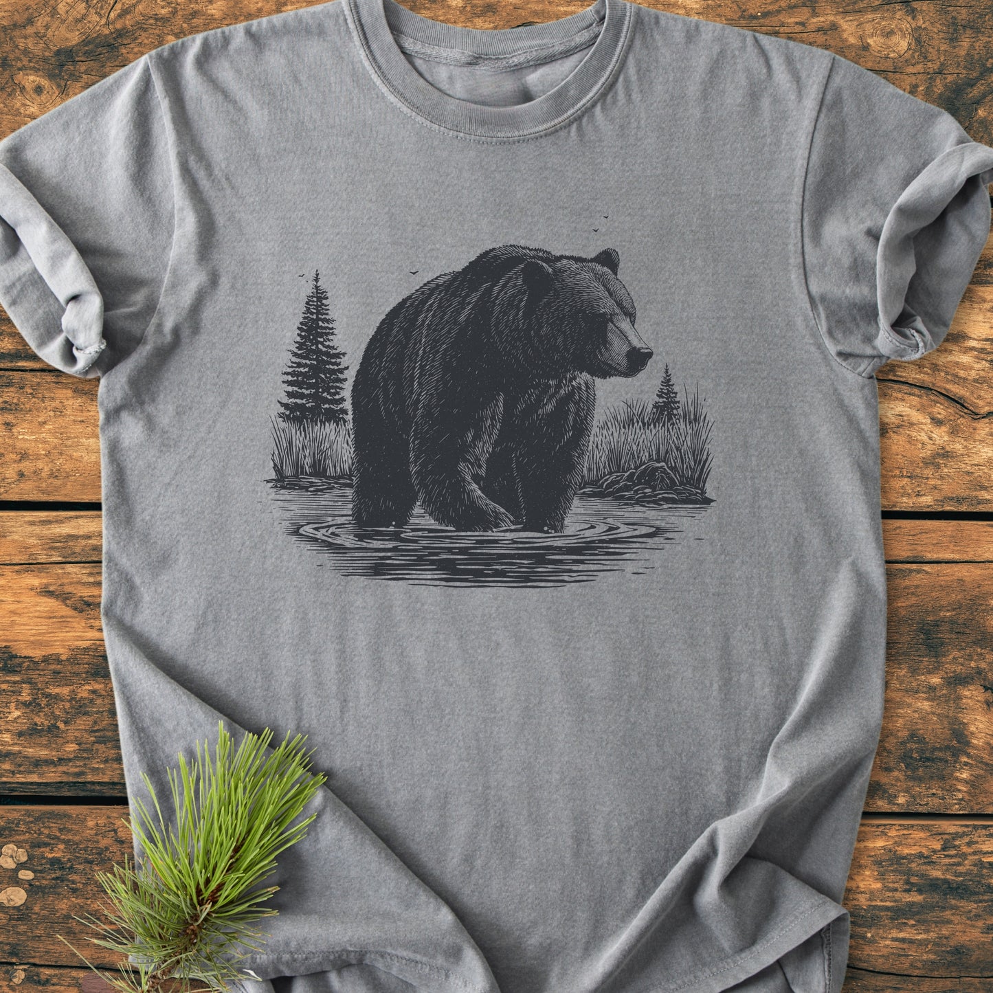 Majestic Grizzly - Vintage Wash Tee features a detailed bear illustration on a heather-gray T-shirt, styled with a pine sprig. Crafted from soft, durable ring-spun cotton for everyday comfort.