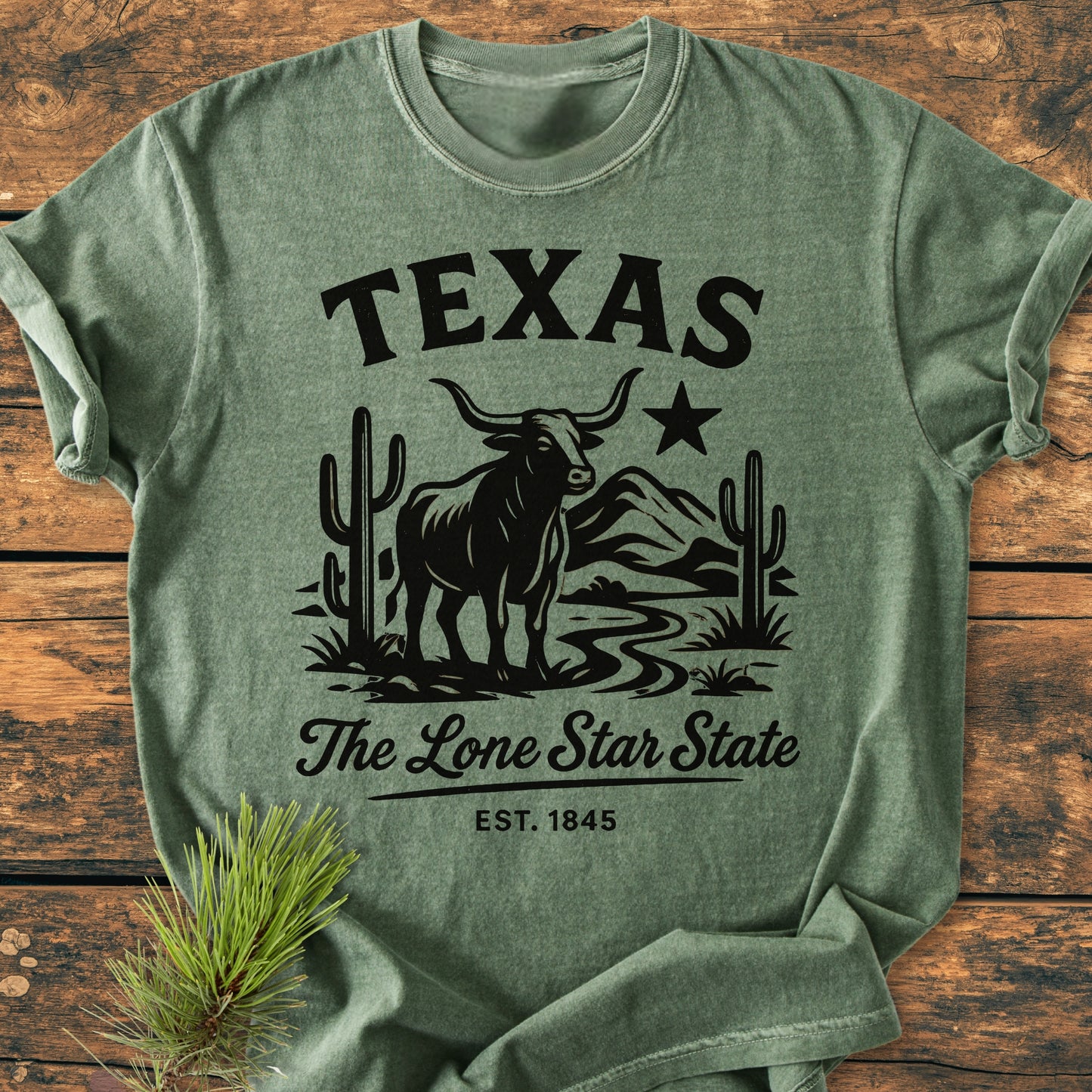 Texas, The Lone Star State - Vintage Wash Tee: Heather-green shirt with TEXAS in block letters, featuring a longhorn, saguaros, river, mountains, and script The Lone Star State with EST. 1845.