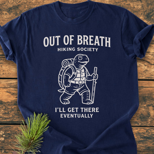 Out Of Breath Turtle - Vintage Wash Tee features a hiking turtle graphic with playful text on a soft, navy-blue, garment-dyed T-shirt, highlighting its cozy, relaxed fit and durable construction.