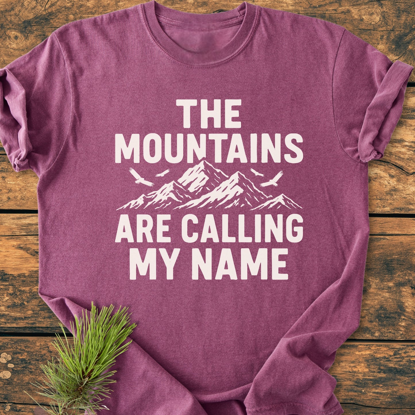 Heather-purple Calling My Name - Vintage Wash Tee with snow-capped mountains graphic and birds. Features slogan, rustic pine branch accent, 100% ring-spun cotton, relaxed fit, and durable construction.