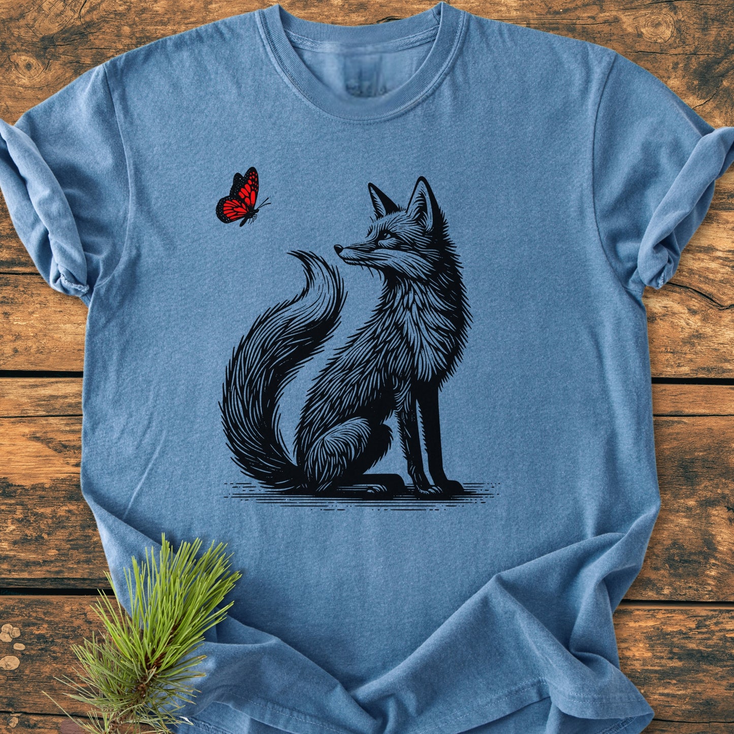 Fox And Butterfly - Vintage Wash Tee features a stylized fox and butterfly design on a heather-blue T-shirt, highlighting its soft, relaxed fit and durable, garment-dyed cotton fabric.