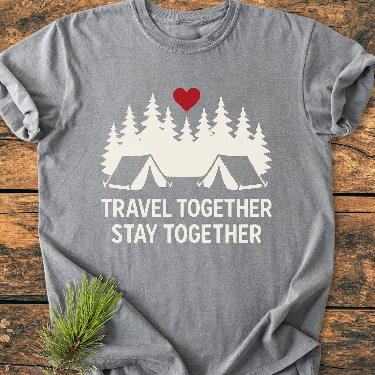 Travel Together Stay Together - Vintage Wash Tee features a heather-gray design with a white pine-tree forest graphic, two tents, and a red heart. Rustic pine sprigs accentuate the outdoorsy vibe.