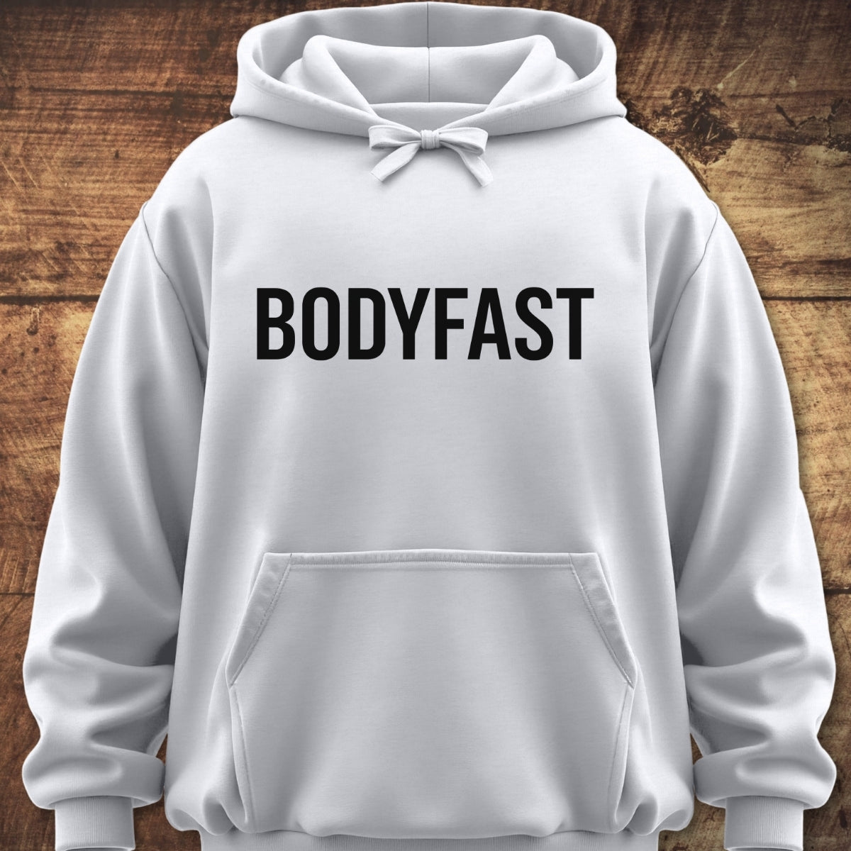 BODYFAST Hoodie displayed with a relaxed fit, featuring a hood with drawstrings, kangaroo pocket, and bold black lettering on the chest, ideal for layering in various settings.