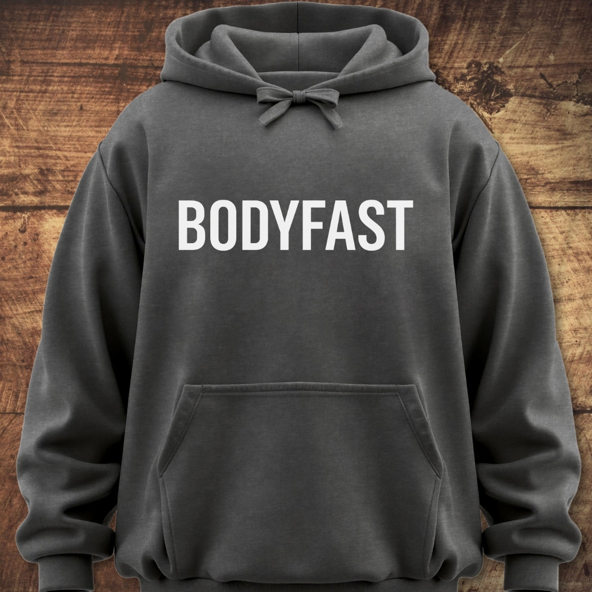 Charcoal-gray BODYFAST Hoodie with a kangaroo pocket and drawstring hood, featuring bold white chest lettering, ideal for layering with a garment-dyed, vintage look and relaxed unisex fit.