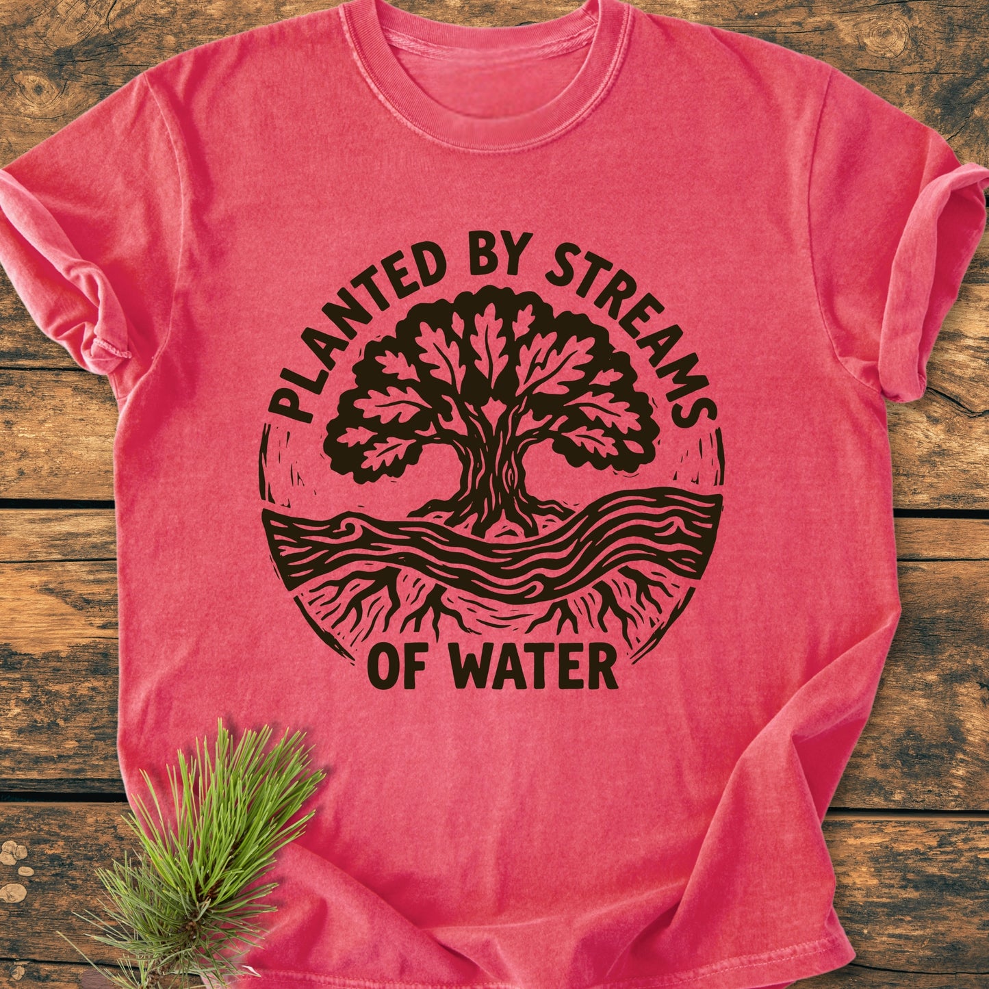 Planted By Streams, Psalm 1,3 - Vintage Wash Tee: Washed-out red/pink T-shirt with black tree graphic and text, laid flat on wood; features soft, garment-dyed fabric and relaxed fit.