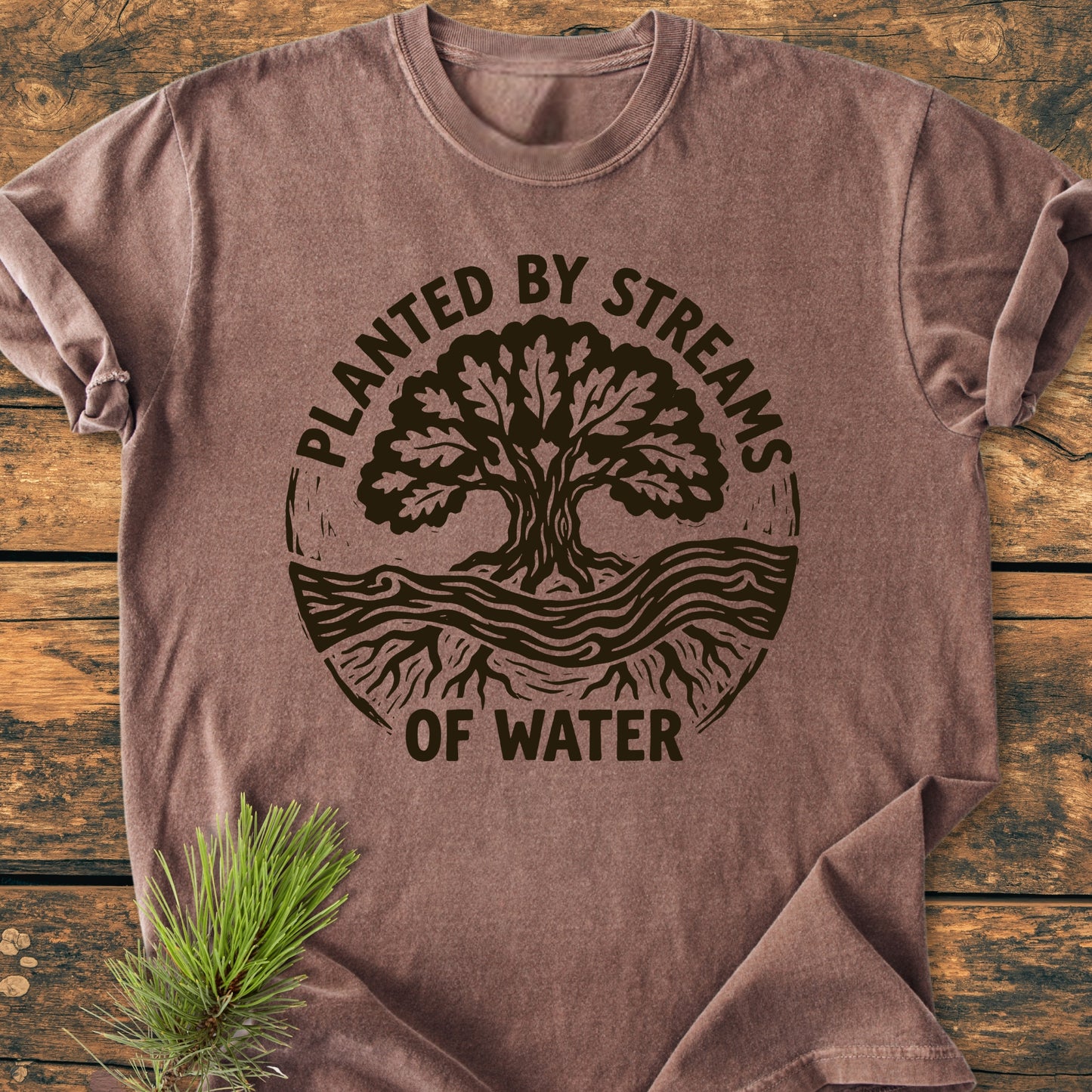 Planted By Streams, Psalm 1,3 - Vintage Wash Tee features a rustic tree and streams graphic on a brown heather T-shirt, offering comfort with its soft, relaxed fit and durable design.