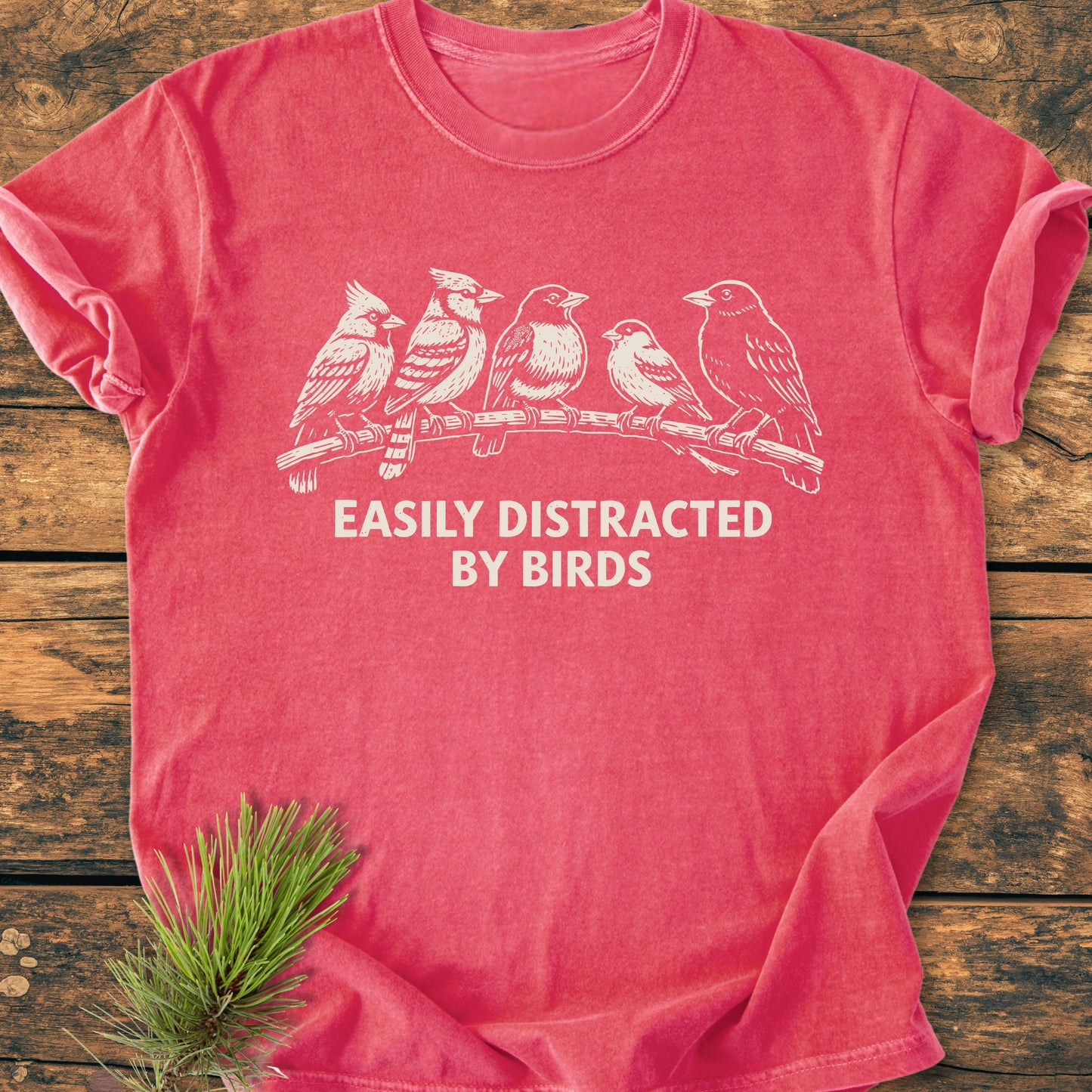 Easily Distracted By Birds - Vintage Wash Tee features a whimsical bird design and bold caption on soft, garment-dyed fabric, showcasing its relaxed fit and durability with double-needle stitching.