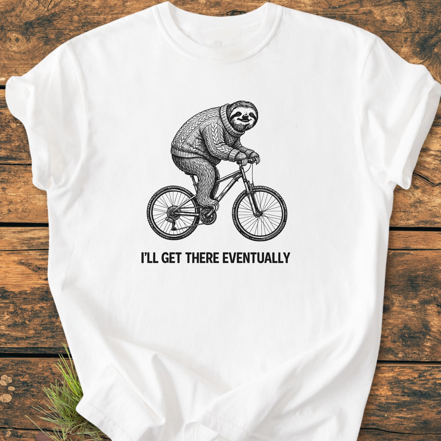I'll Get There Eventually - Vintage Wash Tee featuring a sloth in a sweater on a bicycle, printed on a laid-flat, garment-dyed white T-shirt with a relaxed fit and durable stitching.