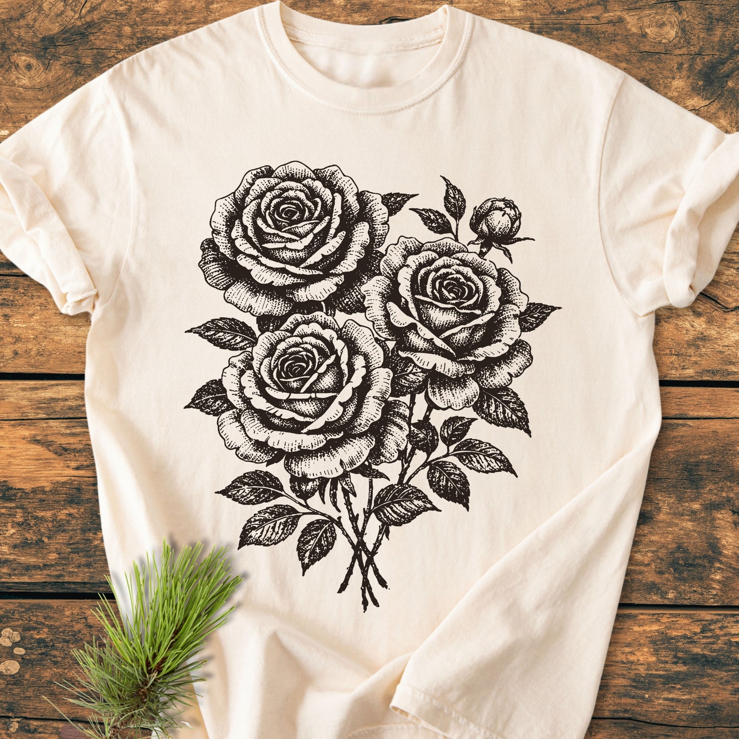 Rose Bouquet - Vintage Heavyweight Tee: Laid on a wooden surface, this light-cream, short-sleeve tee features a bold black line-art of roses, offering both comfort and style in 100% ring-spun cotton.