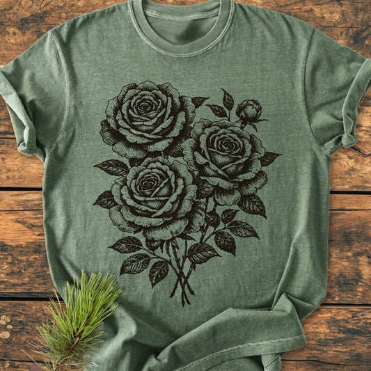 Rose Bouquet - Vintage Heavyweight Tee features a black line-drawing of roses, draped on a wooden surface. Made from 100% ring-spun cotton, it offers a relaxed fit and durable construction.