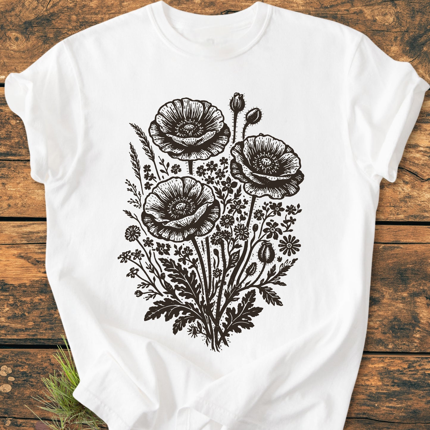 Wildflower Bouquet - Vintage Heavyweight Tee featuring a detailed black botanical illustration of poppy blossoms and wildflowers on a white cotton shirt, highlighting its intricate sketch-style design and relaxed fit.