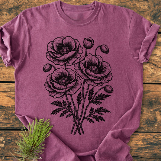 The Poppy Bouquet - Vintage Heavyweight Tee features a botanical poppy print on a soft, heather-purple T-shirt, offering comfort and durability with its relaxed fit and double-needle stitching.