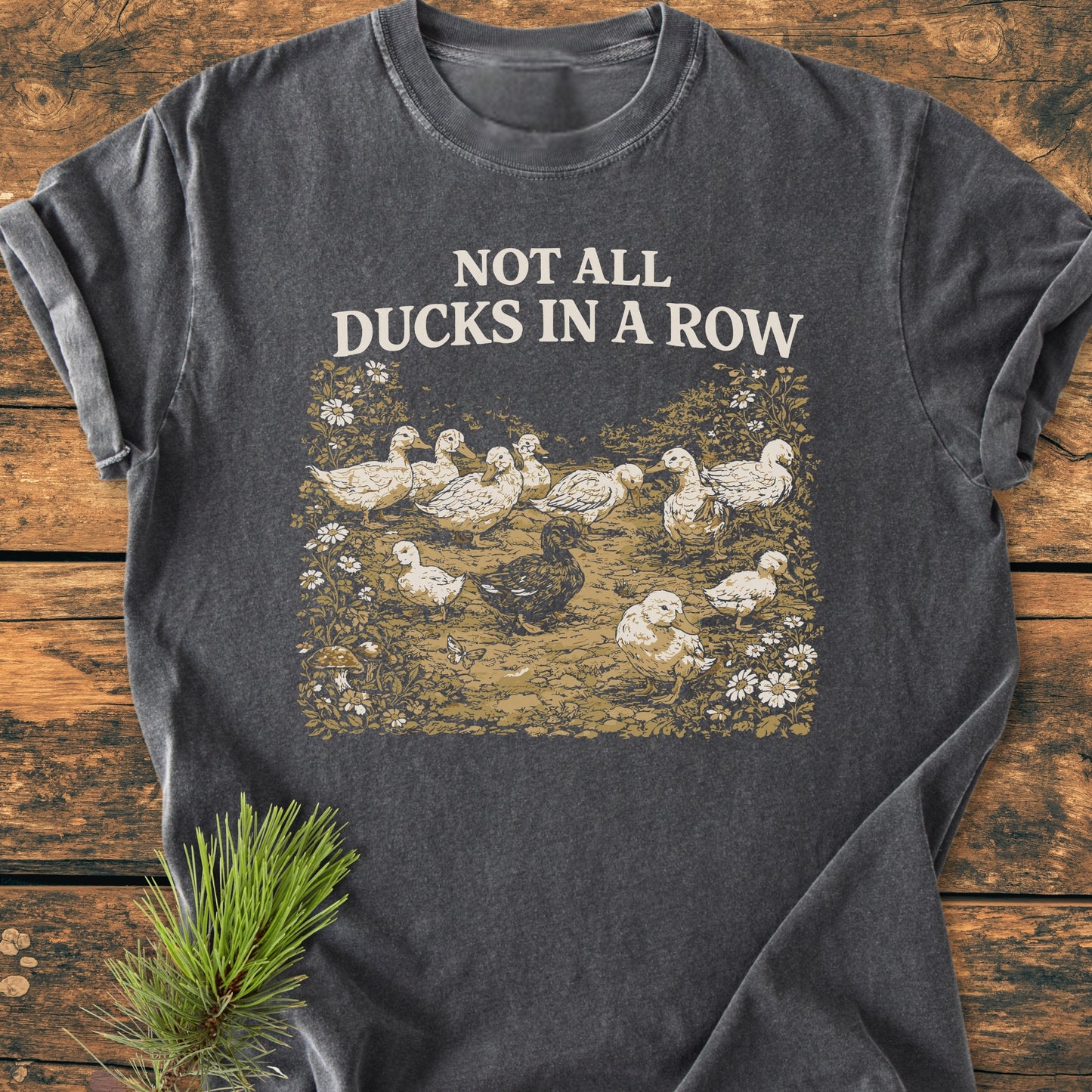 Not All Ducks In A Row - Vintage Wash Tee: A dark-heather gray T-shirt featuring a vintage duck illustration with daisies, crafted from soft, garment-dyed 100% ring-spun cotton for comfort and durability.