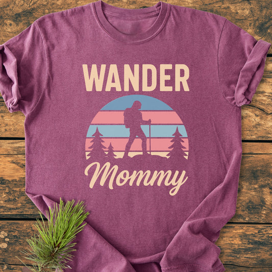 Wander Mommy Retro - Vintage Heavyweight Tee features a heathered purple design with a vintage outdoor graphic of a hiker and WANDER text, crafted from soft, durable 100% ring-spun cotton.