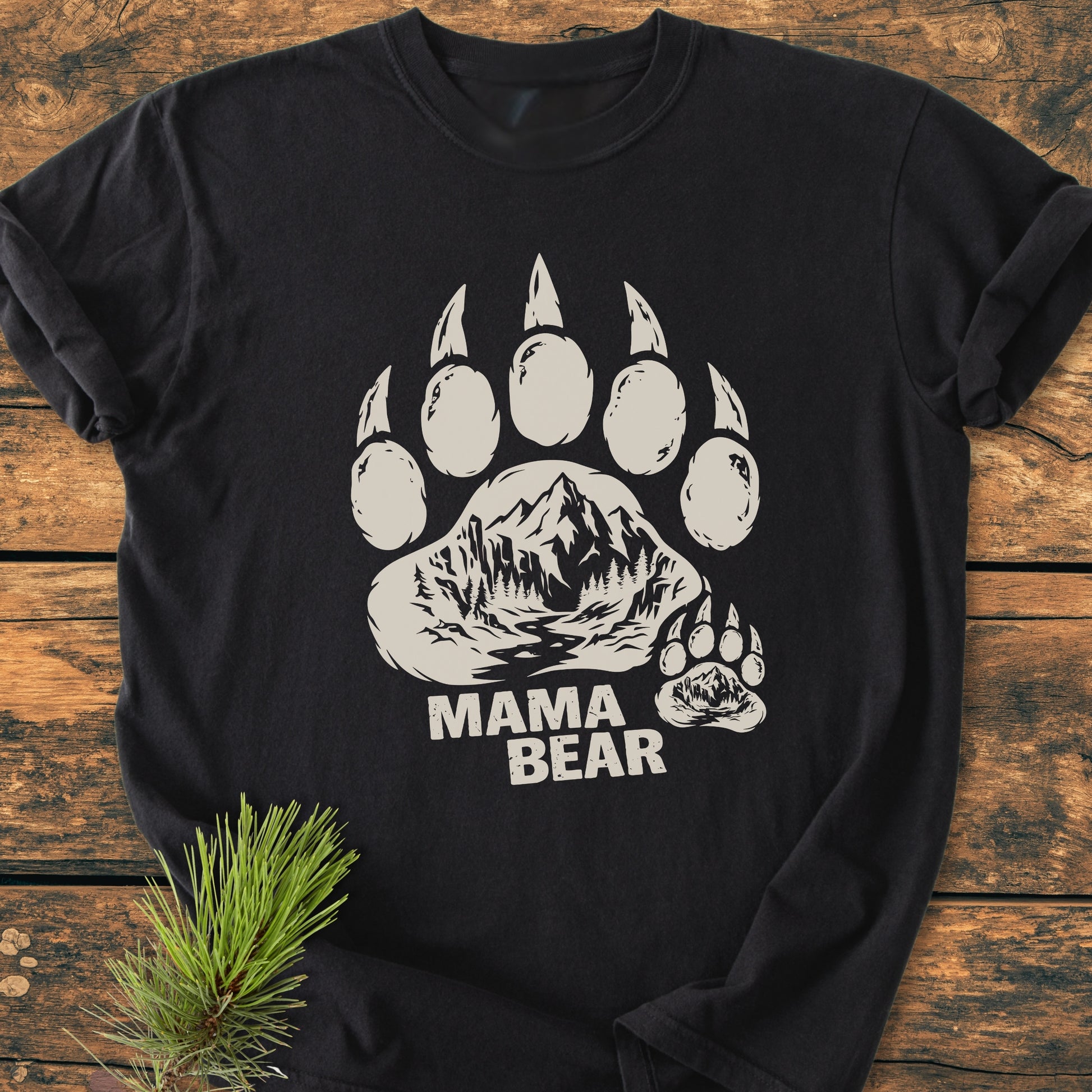 Mama Bear - Vintage Heavyweight Tee featuring a large bear paw print with a mountain scene and MAMA BEAR text, showcased on a laid-back, soft-washed, 100% cotton fabric.