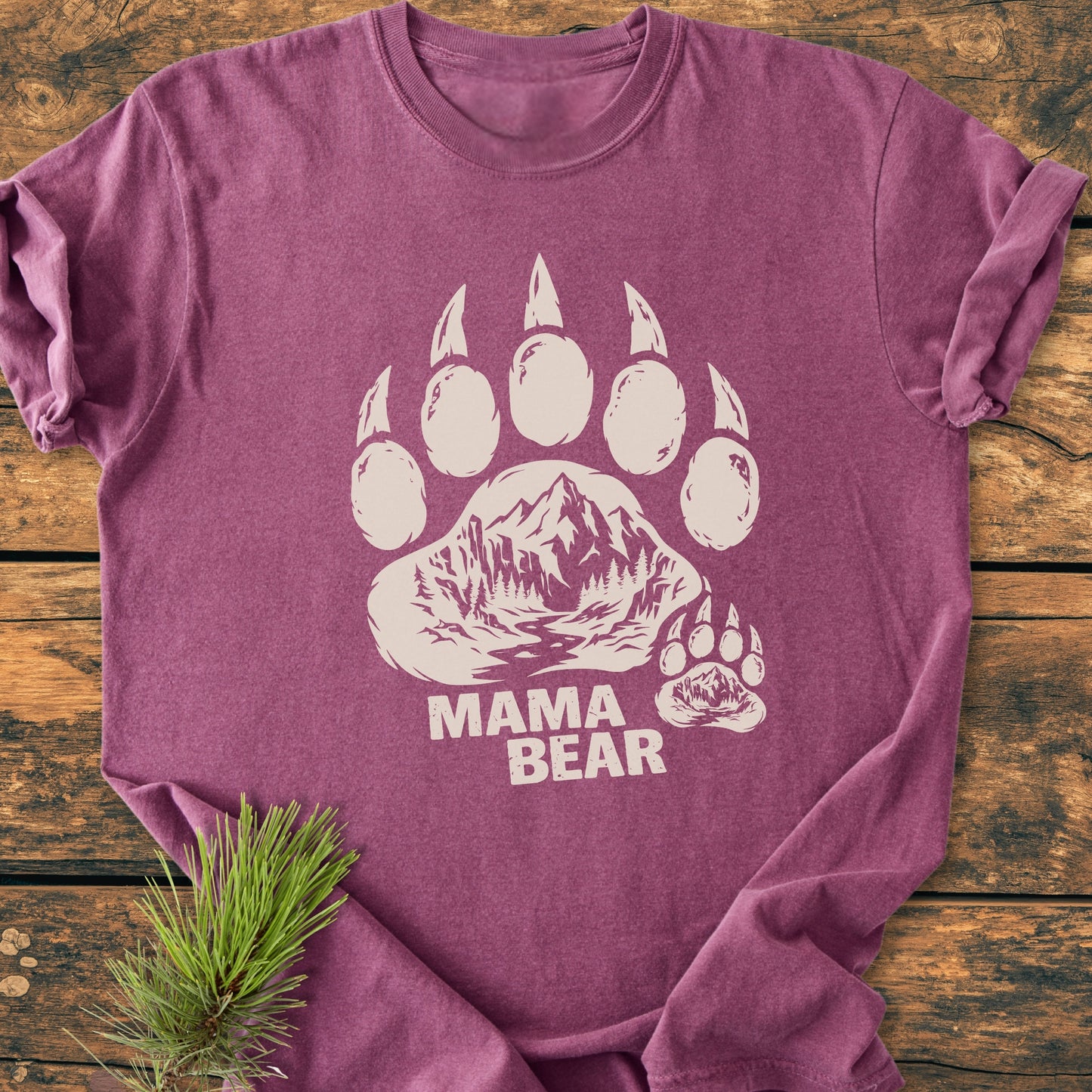 Mama Bear - Vintage Heavyweight Tee features a stylized bear paw with a mountain scene on a soft, ring-spun cotton shirt, laid flat, showcasing its durable, relaxed fit.