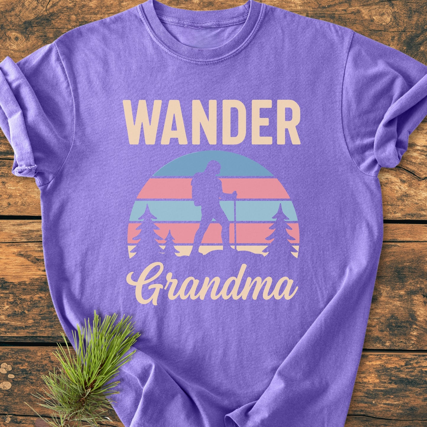 Wander Grandma - Vintage Heavyweight Tee: Purple T-shirt featuring a hiker silhouette, striped sun, and pine trees. Crafted from 100% ring-spun cotton, this Comfort Colors tee offers a relaxed, pre-shrunk fit.