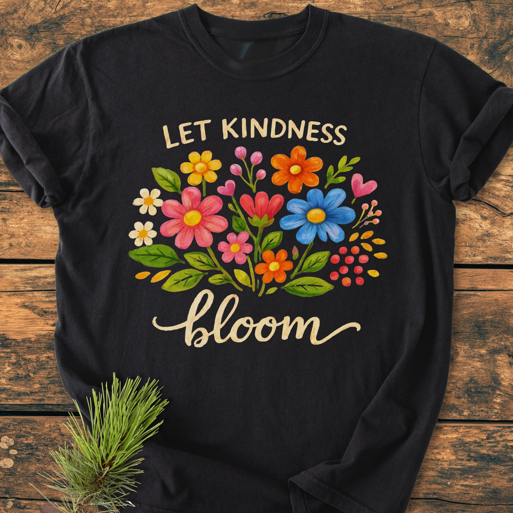 Let Kindness Bloom - Vintage Wash Tee features a hand-painted floral bouquet with LET KINDNESS bloom text, showcasing vibrant blooms on a black, soft-washed, 100% ring-spun cotton T-shirt.