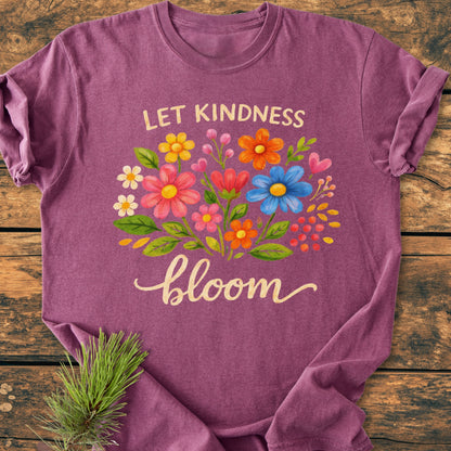 Let Kindness Bloom - Vintage Wash Tee features a floral bouquet with uplifting text on a heathered purple T-shirt, showcasing a casual, relaxed fit with durable, soft-washed cotton for everyday comfort.